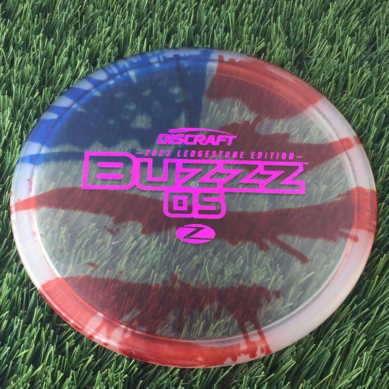 Discraft Elite Z Fly-Dyed BuzzzOS with 2023 Ledgestone Edition – Wave 2 Stamp – 180g – Translucent Flag