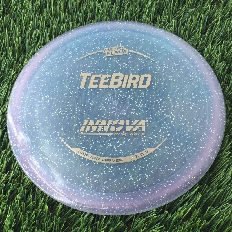 Innova Champion Metal Flake Teebird with Burst Logo Stock Stamp – 149g – Translucent Bluish Clear