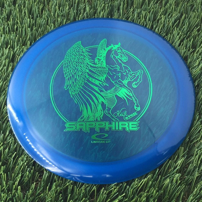 Latitude 64 Opto Sapphire with Keiti Tatte Team Series 2023 Stamp – 164g – Translucent Blue