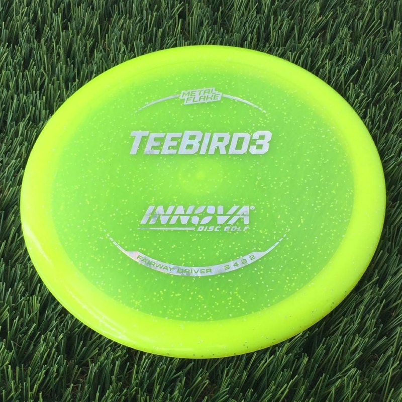 Innova Champion Metal Flake Teebird3 with Burst Logo Stock Stamp – 169g – Translucent Yellow