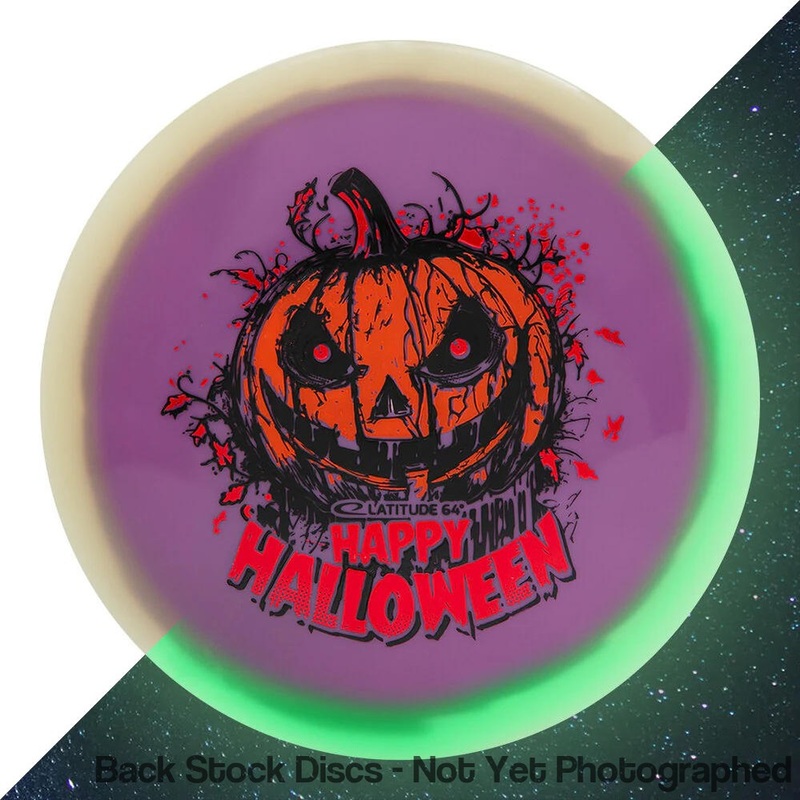 Latitude 64 Opto Orbit Moonshine Glow Saint Fairway Driver with Happy Halloween Spooky Pumpkin – Triple Foil 2024 Stamp [Back Stock Inventory – Disc and Stamp Color WILL VARY]